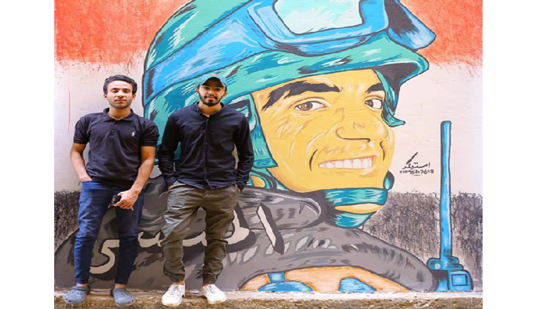  رسم لوحة فنية للشهيد أحمد المنسى على أحد جدران شوارع القوصية بأسيوط
