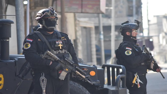  بالصور أفراد شرطة مكافحة الإرهاب العراقية يرتدون الصليب في الموصل لتأمين زيارة البابا 